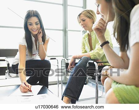 Stock Photograph - women at the office. Fotosearch