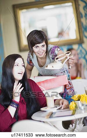 Stock Image - women having a break in a coffee house. Fotosearch