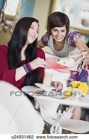 women having a break in a coffee house View Large Photo Image Stock Image - women having a break in a coffee house. Fotosearch