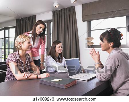 Stock Image - women in a reunion at the office. Fotosearch