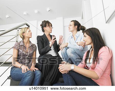 Stock Image - women on stairs. Fotosearch