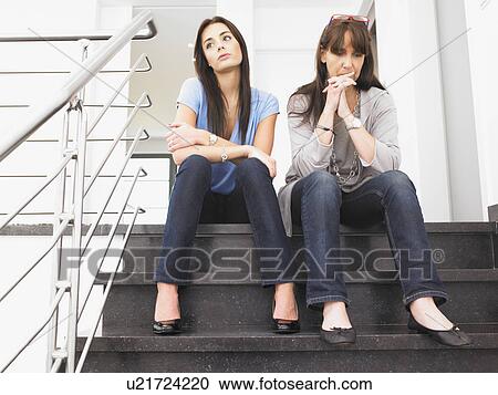 Stock Image - women on stairs. Fotosearch