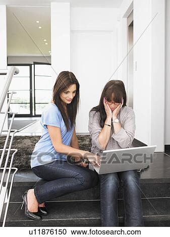 women on stairs with laptop View Large Photo Image Stock Image - women on stairs with laptop. Fotosearch