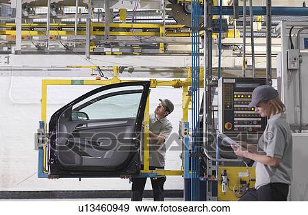 Worker Inspecting Car Door In Plant View Large Photo Image Stock Photo - Worker Inspecting Car Door In Plant. Fotosearch