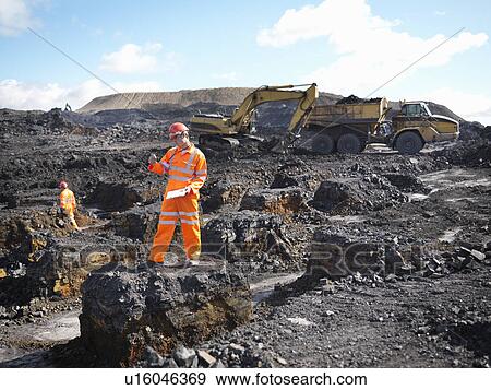 Worker Surveying Coal Mine View Large Photo Image Stock Photo - Worker Surveying Coal Mine. Fotosearch