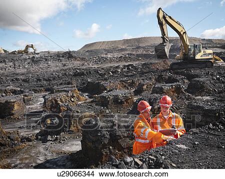 Picture - Workers Inspecting Coal In Mine. Fotosearch