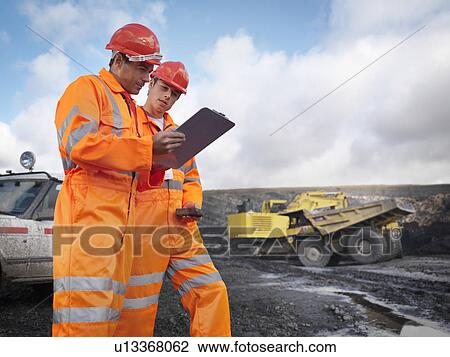 Workers With Clipboard In Coal Mine View Large Photo Image Stock Image - Workers With Clipboard In Coal Mine. Fotosearch