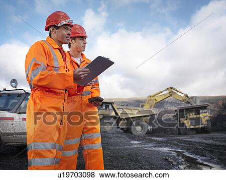 Stock Photo - Workers With Clipboard In Coal Mine. Fotosearch