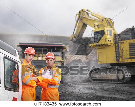 Stock Photography - Workers With Clipboard In Coal Mine. Fotosearch