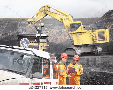 Stock Photography - Workers With Clipboard In Coal Mine. Fotosearch