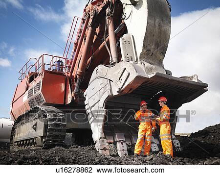 Workers With Digger In Coal Mine View Large Photo Image Stock Image - Workers With Digger In Coal Mine. Fotosearch