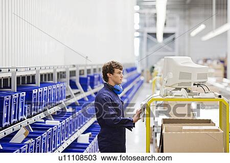 Stock Image - workman at workplace. Fotosearch