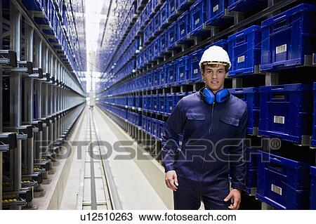 Stock Image - workman in storage. Fotosearch