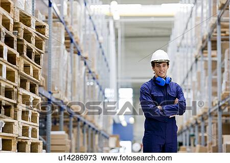 Stock Image - workman in storage. Fotosearch