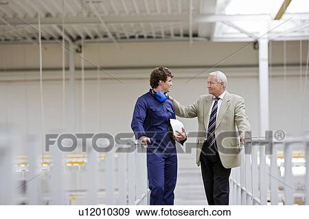workman talking with boss View Large Photo Image Stock Photo - workman talking with boss. Fotosearch