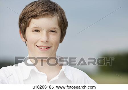 Stock Photography - young boy smiling at viewer. Fotosearch