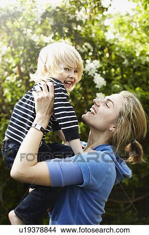 Young boy with mother View Large Photo Image Picture - Young boy with mother. Fotosearch