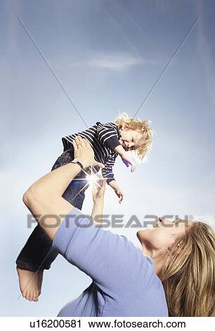 Young boy with mother View Large Photo Image Stock Image - Young boy with mother. Fotosearch