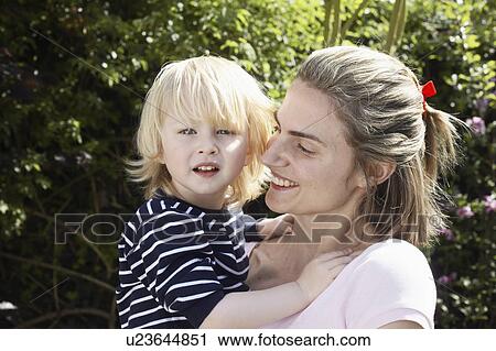 Young boy with mother View Large Photo Image Stock Image - Young boy with mother. Fotosearch