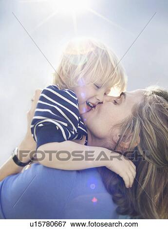 Young boy with mother View Large Photo Image Stock Photo - Young boy with mother. Fotosearch