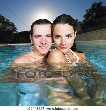 Stock Photo - young couple in pool. Fotosearch