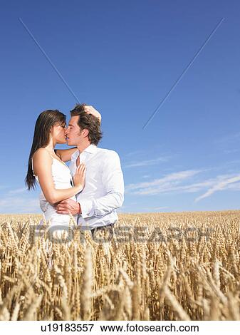 young couple in wheat field View Large Photo Image Stock Photo - young couple in wheat field. Fotosearch