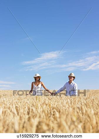 young couple in wheat field View Large Photo Image Stock Photography - young couple in wheat field. Fotosearch