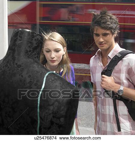 Picture - Young couple looking shop window. Fotosearch