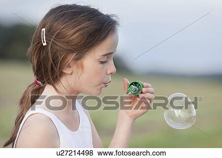 young girl playing with soap bubbles View Large Photo Image Stock Photo - young girl playing with soap bubbles. Fotosearch
