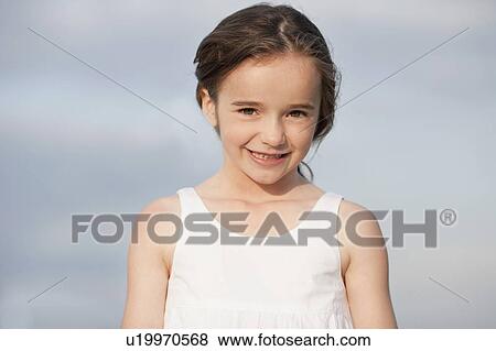 young girl smiling at viewer View Large Photo Image Stock Photo - young girl smiling at viewer. Fotosearch