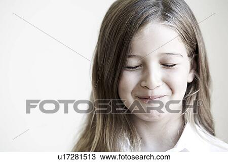 Young girl with crumbs on face View Large Photo Image Stock Image - Young girl with crumbs on face. Fotosearch