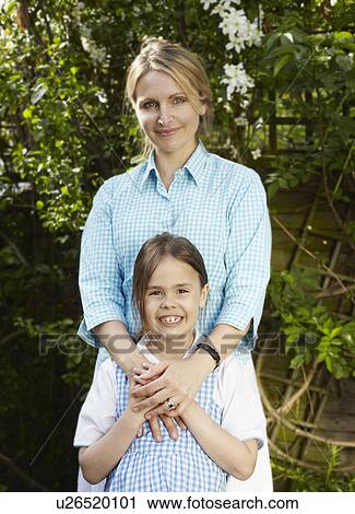 Young girl with mother View Large Photo Image Stock Image - Young girl with mother. Fotosearch