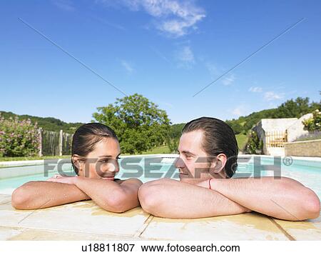 young man and woman in pool View Large Photo Image Stock Photo - young man and woman in pool. Fotosearch