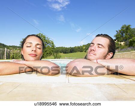 young man and woman in pool View Large Photo Image Stock Photograph - young man and woman in pool. Fotosearch