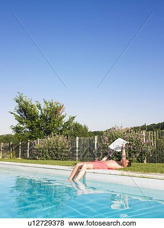 young man by pool View Large Photo Image Stock Photo - young man by pool. Fotosearch