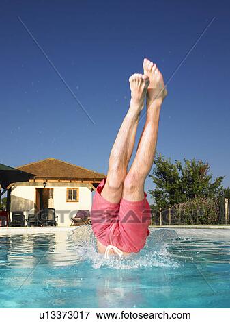 Stock Photo - young man diving. Fotosearch