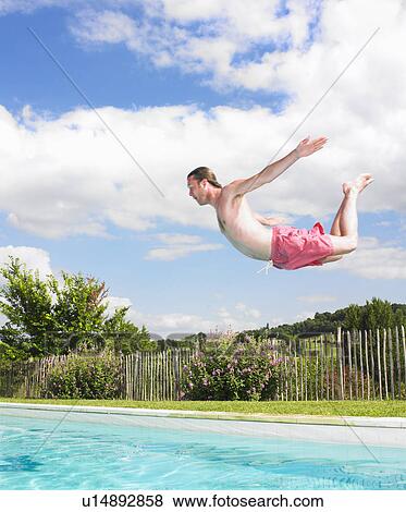 Stock Photo - young man diving. Fotosearch