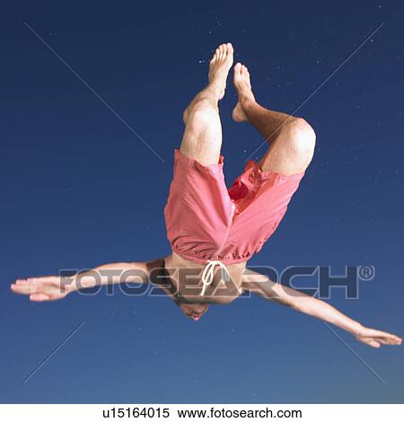 Stock Photography - young man diving. Fotosearch