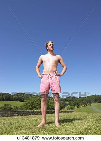 Stock Photo - young man in bathing suit. Fotosearch