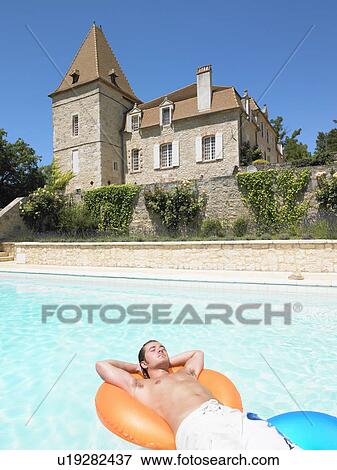 Stock Photo - young man in pool. Fotosearch