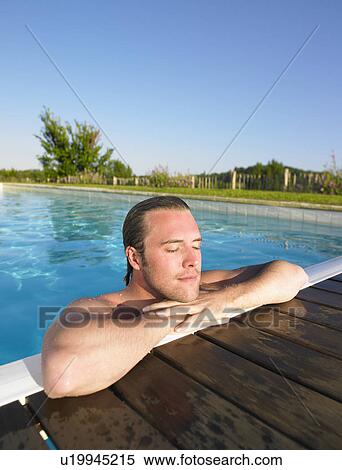 young man in pool View Large Photo Image Stock Photography - young man in pool. Fotosearch