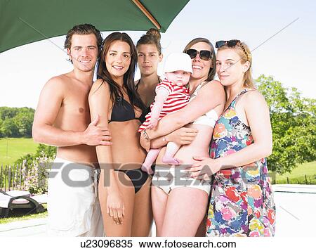 Stock Photography - young people by pool. Fotosearch
