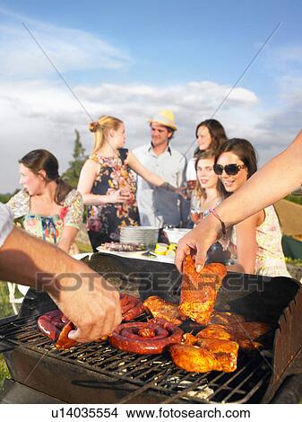 young people having barbecue View Large Photo Image Picture - young people having barbecue. Fotosearch