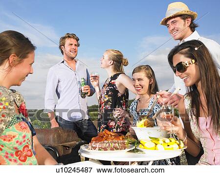 young people having barbecue View Large Photo Image Stock Photo - young people having barbecue. Fotosearch