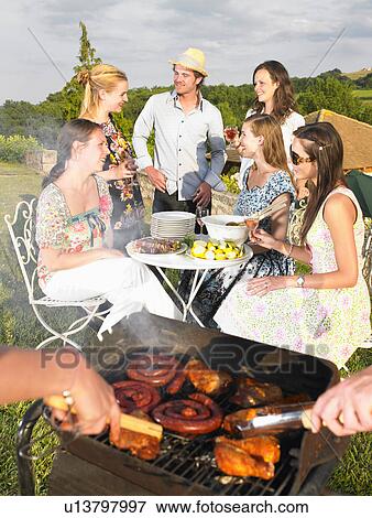 young people having barbecue View Large Photo Image Stock Photo - young people having barbecue. Fotosearch
