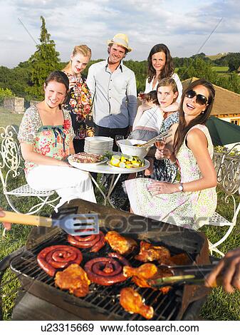 young people having barbecue View Large Photo Image Stock Photo - young people having barbecue. Fotosearch