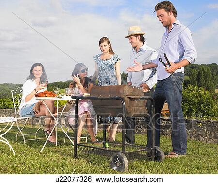 young people having barbecue View Large Photo Image Stock Photograph - young people having barbecue. Fotosearch