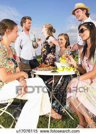 young people having barbecue View Large Photo Image Stock Photography - young people having barbecue. Fotosearch