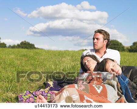 young people lying in field View Large Photo Image Stock Image - young people lying in field. Fotosearch