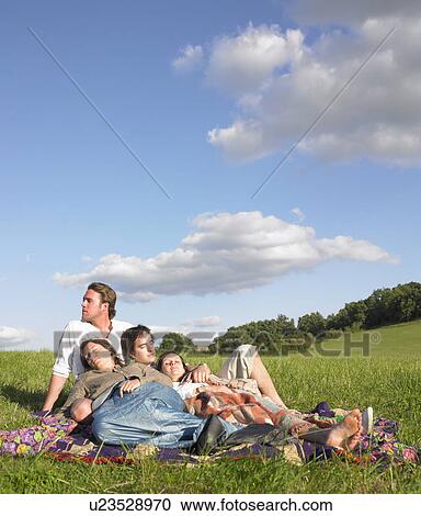 young people lying in field View Large Photo Image Stock Image - young people lying in field. Fotosearch